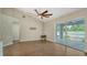 Dining room with hardwood floors, ceiling fan and access to patio at 5687 Milton Ave, Sarasota, FL 34243