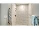 Clean shower with marble tile and modern fixtures at 5687 Milton Ave, Sarasota, FL 34243