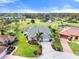 House with golf course and lake views in a community at 6170 Misty Oaks Dr, Sarasota, FL 34243