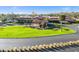 Community clubhouse with a terracotta roof and landscaping at 6170 Misty Oaks Dr, Sarasota, FL 34243