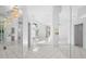 Bright and spacious entryway with mirrored walls at 6170 Misty Oaks Dr, Sarasota, FL 34243