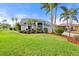 Beautiful house exterior with lush landscaping at 6170 Misty Oaks Dr, Sarasota, FL 34243