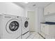 Laundry room with LG washer and dryer at 6170 Misty Oaks Dr, Sarasota, FL 34243