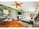 Spacious main bedroom with leafy wallpaper and hardwood floors at 6170 Misty Oaks Dr, Sarasota, FL 34243