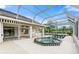 Relaxing pool and spa area with screened enclosure at 6170 Misty Oaks Dr, Sarasota, FL 34243