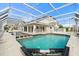 Large pool with covered patio and spa at 6170 Misty Oaks Dr, Sarasota, FL 34243