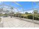 Screened patio with pool and lush landscaping at 6170 Misty Oaks Dr, Sarasota, FL 34243