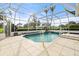 Inviting swimming pool with screened enclosure at 6170 Misty Oaks Dr, Sarasota, FL 34243