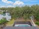 Aerial view of backyard oasis with pool and lake at 6207 93Rd Street E Cir, Bradenton, FL 34202