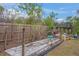 Landscaped backyard with garden beds and wooden fence at 6207 93Rd Street E Cir, Bradenton, FL 34202