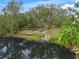 Expansive backyard with fire pit, patio, and lake access at 6207 93Rd Street E Cir, Bradenton, FL 34202