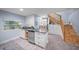 Basement kitchenette with modern cabinetry and staircase at 6207 93Rd Street E Cir, Bradenton, FL 34202