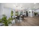 Bright dining room features a wood table, gray chairs, and stylish light fixtures at 6207 93Rd Street E Cir, Bradenton, FL 34202