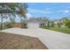 Gray house with a two-car garage and basketball hoop at 6207 93Rd Street E Cir, Bradenton, FL 34202