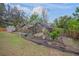 Lush garden with various plants and a shade structure at 6207 93Rd Street E Cir, Bradenton, FL 34202