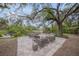 Spacious patio with seating area under a large shade tree at 6207 93Rd Street E Cir, Bradenton, FL 34202