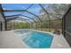 Enclosed pool and patio with lush landscaping at 6207 93Rd Street E Cir, Bradenton, FL 34202