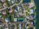 Aerial view of waterfront property with large lot and tennis court at 624 Norsota Way, Sarasota, FL 34242