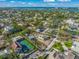 Aerial view of waterfront property with large lot and tennis court at 624 Norsota Way, Sarasota, FL 34242