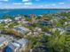 Aerial view of waterfront homes and lush tropical landscape at 624 Norsota Way, Sarasota, FL 34242