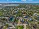 Aerial view of waterfront property with large lot and tennis court at 624 Norsota Way, Sarasota, FL 34242