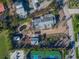 Aerial view of property with tennis court and canal views at 624 Norsota Way, Sarasota, FL 34242