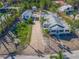 Aerial view of property with main house, guesthouse, and a long driveway at 624 Norsota Way, Sarasota, FL 34242