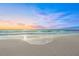 Scenic beach sunset with soft waves and colorful sky at 624 Norsota Way, Sarasota, FL 34242