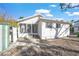 White house with screened porch and side yard at 624 Norsota Way, Sarasota, FL 34242