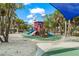 playground with play structures and sandy area at 624 Norsota Way, Sarasota, FL 34242