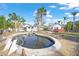 Kidney-shaped pool, needs attention, surrounded by palm trees at 624 Norsota Way, Sarasota, FL 34242