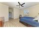 Spacious bedroom with wood-look floors and ceiling fan at 6512 Willowshire Way, Bradenton, FL 34212