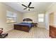 Bright bedroom with wood flooring and a ceiling fan at 6512 Willowshire Way, Bradenton, FL 34212