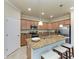 Modern kitchen with granite countertops and stainless steel appliances at 6512 Willowshire Way, Bradenton, FL 34212