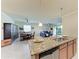 Kitchen island with breakfast bar overlooks the living and dining areas at 6512 Willowshire Way, Bradenton, FL 34212