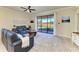 Spacious living room with sliding glass doors leading to a backyard patio at 6512 Willowshire Way, Bradenton, FL 34212