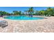 Large kidney shaped pool with plenty of lounge chairs at 6512 Willowshire Way, Bradenton, FL 34212