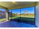 Relaxing screened patio with paver stones overlooking a lush green landscape at 6512 Willowshire Way, Bradenton, FL 34212