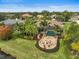 Aerial view of home, pool, and lush landscaping at 654 Trenton Way, Osprey, FL 34229