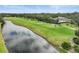 Aerial view of golf course, canal and home at 654 Trenton Way, Osprey, FL 34229