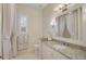 Well-appointed bathroom with granite vanity and shower/tub combo at 654 Trenton Way, Osprey, FL 34229