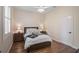 Cozy bedroom featuring wood floors and ample natural light at 654 Trenton Way, Osprey, FL 34229