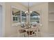 Kitchen breakfast nook with table and chairs, overlooking the pool at 654 Trenton Way, Osprey, FL 34229