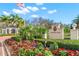 The Oaks Club entrance with lush landscaping and signage at 654 Trenton Way, Osprey, FL 34229