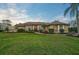 Single story home with tile roof and manicured landscaping at 654 Trenton Way, Osprey, FL 34229