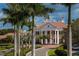 Grand clubhouse entrance with columns and red tile roof at 654 Trenton Way, Osprey, FL 34229