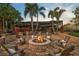 Relaxing fire pit area with comfortable seating in the backyard at 654 Trenton Way, Osprey, FL 34229