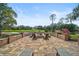 Gorgeous fire pit overlooking a tranquil golf course at 654 Trenton Way, Osprey, FL 34229