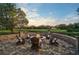 Evening view of fire pit and seating area on patio at 654 Trenton Way, Osprey, FL 34229