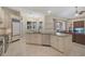 Modern kitchen with large island and stainless steel appliances at 654 Trenton Way, Osprey, FL 34229